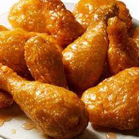 Honey Garlic Wings · A soy based sauce that is sweet and savory infused with pungent pieces of garlic.
