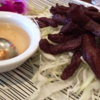 Thai Beef Jerky · Sliced and marinated sirloin jerked with Thai seasoning.