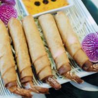 Shrimp Wraps (5 Pieces) · Deep-fried shrimps wrapped with crispy egg roll skins. Served with Thai sweet & sour sauce.