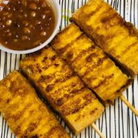 2. Tofu Satay (4 Pieces) · Your choice of grilled tofu marinated in satay sauce on bamboo skewers. Served with peanut a...