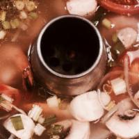 Tom-Yum Soup (Small) · Thai spicy and tangy soup with tomatoes, mushrooms, carrots and onions.