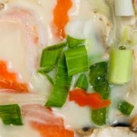 Tom-Kha Soup (Small) · Rich, creamy coconut soup with mushrooms, and carrots.