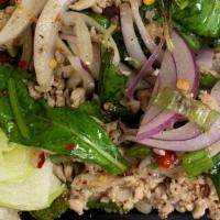 Larb Gai (Thai Ground Chicken Salad) · Seasoned ground chicken garnished with onions, roasted rice powder,  and mint leaves with ch...