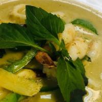 Green Curry · Spicy. Your choice of meat cooked in coconut milk, green curry sauce with bamboo shoots, egg...