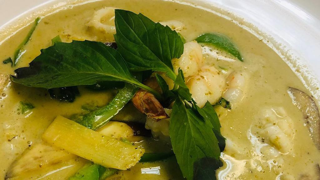 Green Curry · Spicy. Your choice of meat cooked in coconut milk, green curry sauce with bamboo shoots, eggplants, bell peppers and basil leaves.