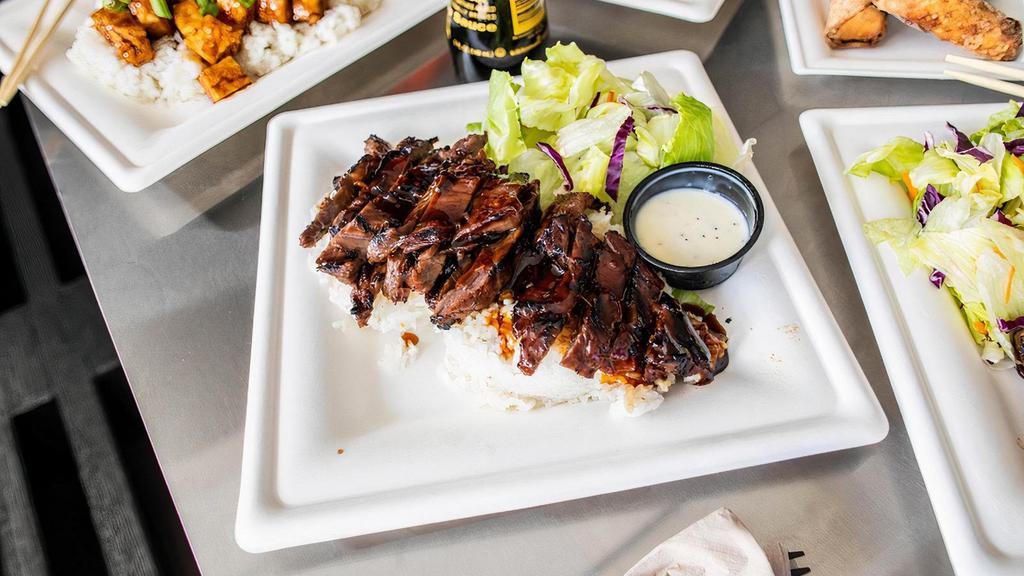 Beef Teriyaki Meal · Over a half pound of marinated skirt steak, grilled to perfection. Covered in fresh teriyaki sauce and served over a bed of rice with a simple side salad.