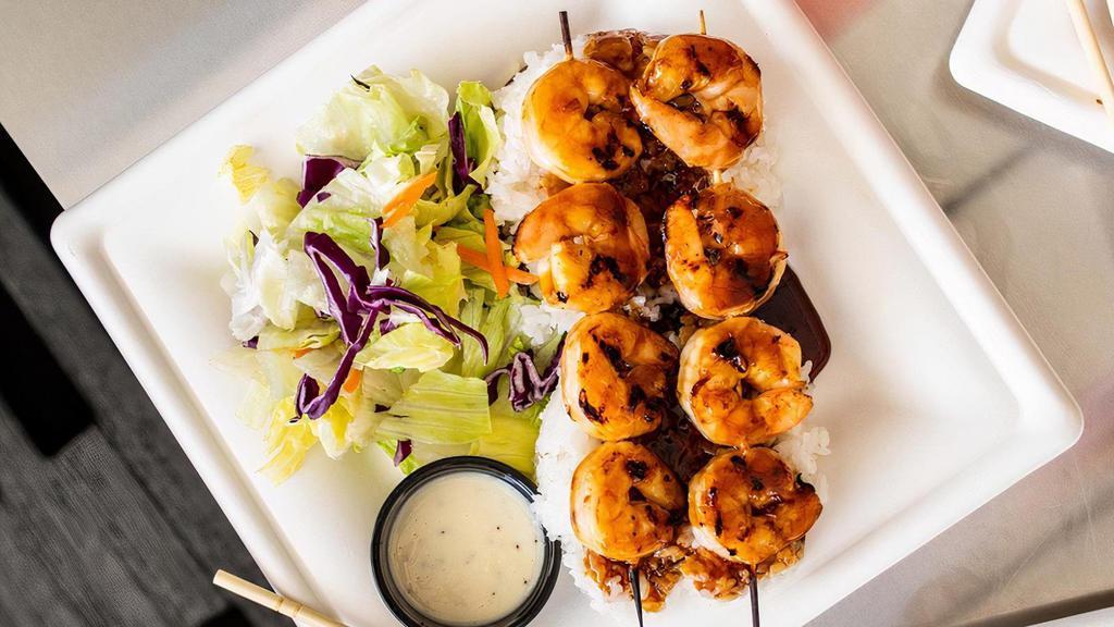 Shrimp Teriyaki Meal · A dish with eight large marinated shrimp, grilled to perfection. Covered in fresh teriyaki sauce and served over a bed of rice with a simple side salad.
