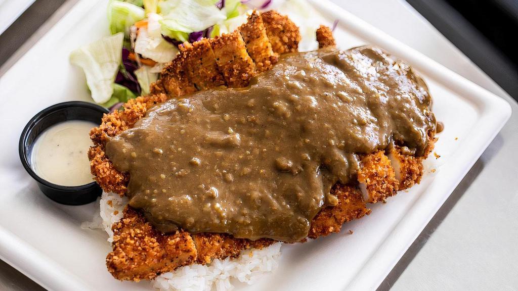 Pork Katsu Curry Meal · Pork Katsu Curry is an absolute favorite. Panko breadcrumb coated pork served with a traditional Japanese Curry sauce over the top. The meal comes with Calrose rice and a side salad.