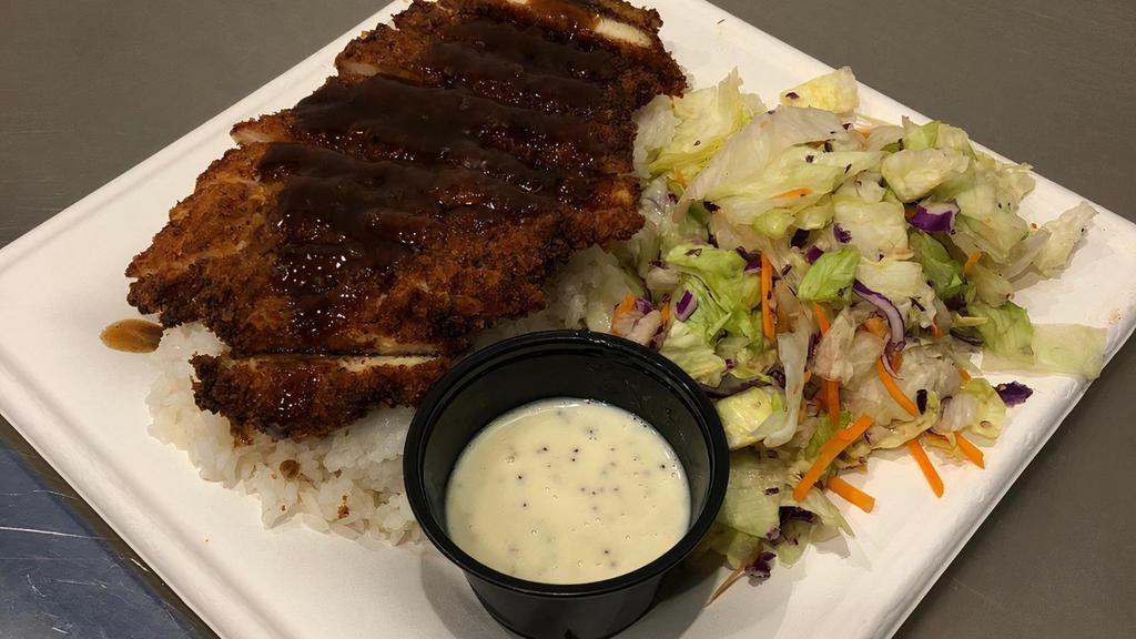 Chicken Katsu Meal · Chicken Katsu is an absolute favorite. Panko breadcrumb coated chicken served with a traditional katsu sauce over the top. The meal comes with calrose rice and a side salad.