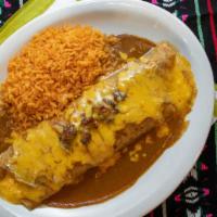 Fajitas Burrito · Large flour tortilla filled with beef fajita and refried beans, covered with gravy and chees...