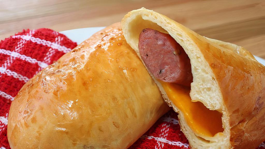 Sausage And Cheese Kolache · Locally made, delivered fresh 5 days a week by Main Street Bakery-Grapevine. A hearty breakfast pastry made with a fluffy, sweet breading around a cheese filled sausage.