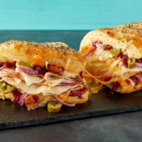 Bbq Chicken Calzone · Included: Chicken, Chopped Bacon, Jalapeños, Red Onions, Mozzarella, Mild Cheddar, BBQ Sauce.