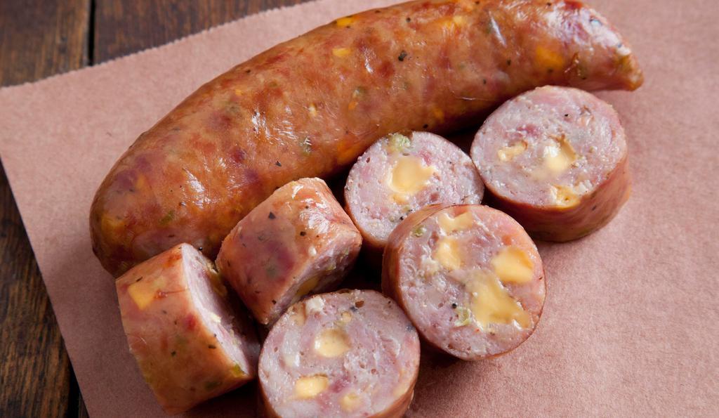 Jalapeño Cheddar Sausage · Price per half pound. A blend of premium beef and pork mixed with fresh jalapeños and real cheddar cheese. Coarse-ground in a natural pork casing.