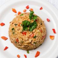 Arroz Chaufa · Peruvian fried rice dish. Mix of fried rice with vegetables, eggs, and chicken cooked in hig...
