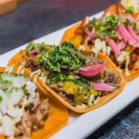Taco Plate · Choice of any three tacos served with a side of rice and beans.
