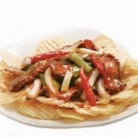 Mongolian Chicken · Hot. Spicy Mongolian sauce, white and green onions, chili peppers with crispy rice noodles.