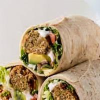 Falafel Wrap · Wrap filled with 4 pieces of falafel, tomatoes, lettuce, pickles, & tahini sauce