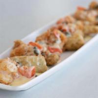 Shrimp Campari · Lightly floured and fried shrimp topped with a lemon butter sauce, tomatoes, and capers.