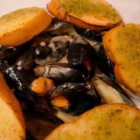 Mussels · Fresh black mussels steamed in a classic garlic white wine sauce.