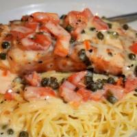 Salmon Sicily · Grilled salmon, tomatoes, and capers in a lemon dill sauce. Served over angel hair pasta or ...