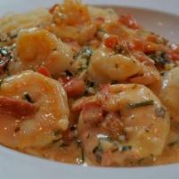 Scampi · Sauteed shrimp, garlic wine sauce atop angel hair pasta.