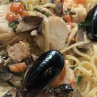 Di Mare · Shrimp, scallops, mussels, mushrooms, chices, and tomatoes in a white wine basil butter sauc...