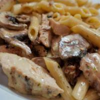 Verona W/Chicken · Mushrooms, chicken, and bacon with penne pasta tossed in a cilantro cream sauce.