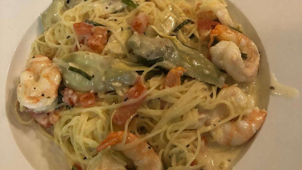 Picatta W/Shrimp · Sauteed shrimp topped with artichoke hearts, diced tomatoes, chives, and capers with angel hair pasta in a lemon wine sauce.