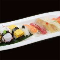 Sushi Lover · 10 different kinds of sushi . Served with miso soup and salad