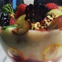 Coconut Yogurt · Cultured coconut cashew yogurt, strawberry coulis, homemade granola, fresh fruit, agave, car...