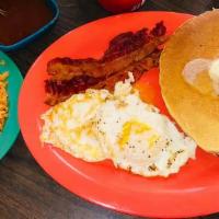 Pancake Plate · Two pancakes, two eggs, two bacon strips, or sausage. Served with potatoes, beans, and torti...