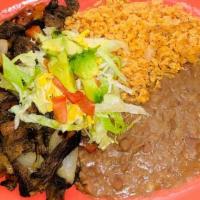 Fajita Plate · Juicy marinate strips of chicken or beef fajita, cooked with onions and diced tomatoes, lett...