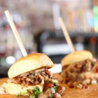 Bbq Pulled Pork Slider · Slow roasted pulled pork with onion and cilantro topped with BBQ sauce.