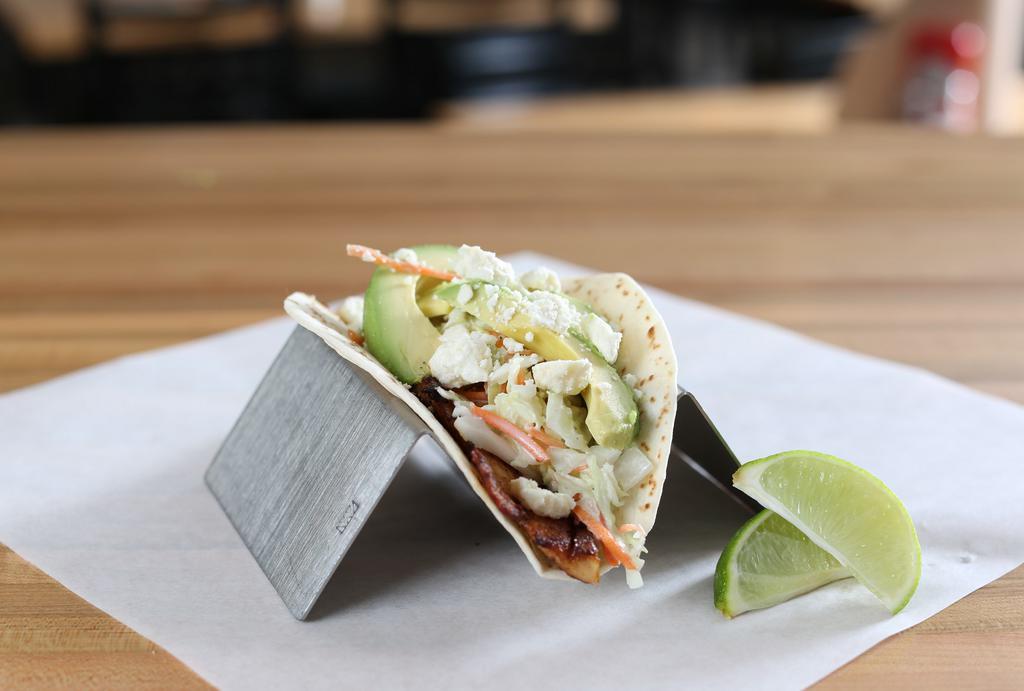 Grilled Tilapia · Grilled tilapia- house made slaw - fresh avocado - topped with feta