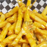 Jc'S Queso Fries · Topped with our famous homemade queso.