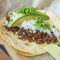Democrat · Shredded beef barbacoa topped with fresh avocado, cotija cheese, cilantro, onions & a wedge ...