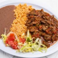Bistec A La Mexicana · Steak strips cooked with onions, tomatoes and jalapenos.