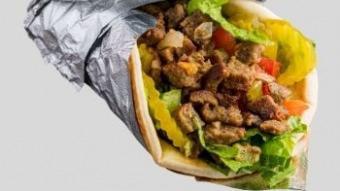 Lamb Gyro Sandwich · Lamb gyro served in pita with romaine lettuce, tomato, onion, cucumber, white sauce, and  ho...