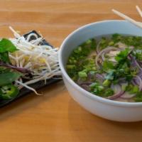 Chicken Noodle Soup · Served with a side of fresh cilantro, basil, sprouts, jalapeno, and lime.