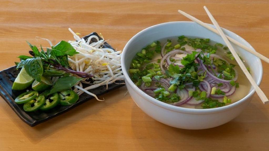 Chicken Noodle Soup · Served with a side of fresh cilantro, basil, sprouts, jalapeno, and lime.
