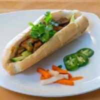 Grilled Pork Sandwich · Grilled marinated pork with cucumber, cilantro, carrot and daikon pickles.