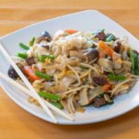 Basil Beef Flat Noodles · Stir fried flat rice noodles with beef, basil and assorted vegetables.