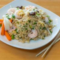 Combination Fried Rice · A combination of stir fried shrimp, chicken, and beef over fried rice, with bean sprouts, wh...