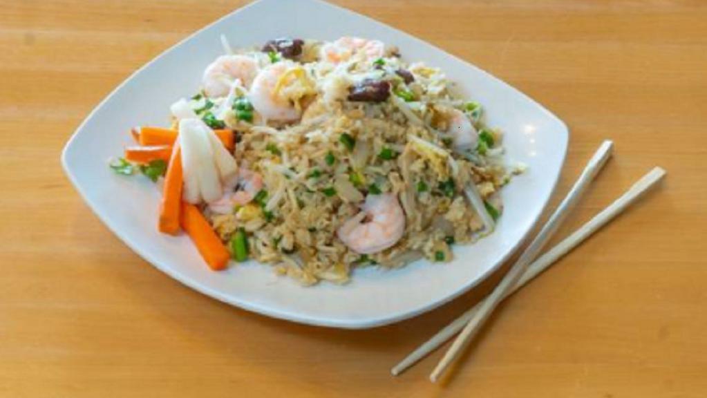 Combination Fried Rice · Stir fry chicken, beef, and shrimp, vegetables, egg, and rice.