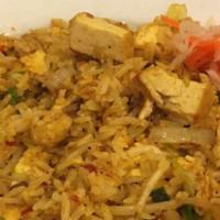 Curry Tofu Fried Rice · Stir fry marinated tofu, vegetables, egg, and rice.