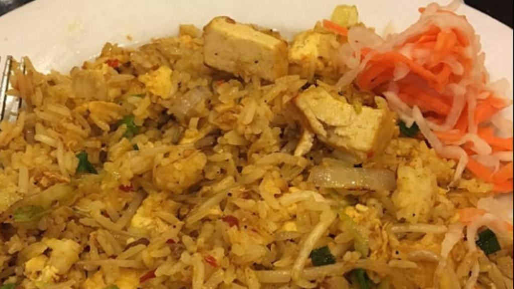 Curry Tofu Fried Rice · Egg fried rice with onions, bean sprouts. mildly spicy yellow curry and lightly fried tofu.