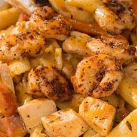 Cajun Pasta · Blackened shrimp, chicken, and Andouille sausage sautéed with onions and peppers in our from...