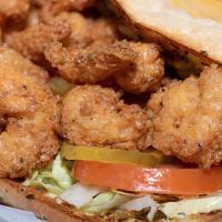 Po Boy · Your choice of meat on toasted French bread with lettuce, tomatoes, pickles, and our housema...