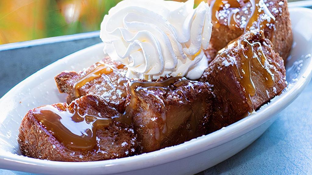 Fried Bread Pudding · Homemade bread pudding, cut into bite size pieces and fried. Topped with cinnamon sugar, fresh whipped cream, and caramel sauce.