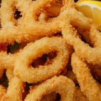 Calamari · Lightly breaded and toasted golden brown.